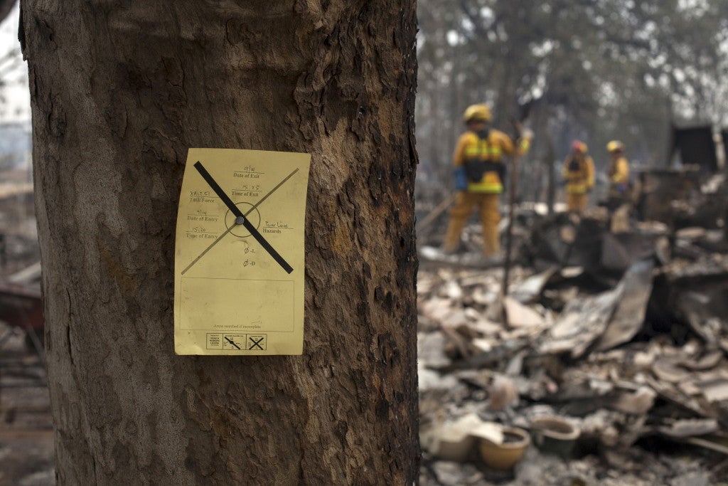 Information posted by rescue personnel to assist firefighters in searching for victims in the rubble of homes. (Photo: REUTERS/David Ryder/Newscom)