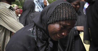 Parents and relatives of kidnapped schoolgirls react during a protest over the Nigerian government's failure to rescue the abducted girls. (Photo: EPA/STR/Newscom)