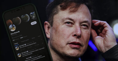 Elon Musk and a phone with the Twitter app
