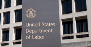U.S. Labor Dept. headquarters building with Labor Dept. sign in front.