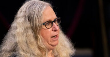 Rachel Levine with a double chin speaks in a confirmation hearing with long blond hair