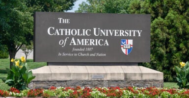 Catholic University of America sign with a crest reading "founded 1887"