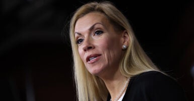 A blonde woman speaks.