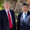 Chinese President Xi Jinping waves to the press as he walks with President Donald Trump at Trump's Mar-a-Lago estate in West Palm Beach, Florida, on April 7, 2017.