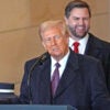 President Donald Trump delivers remarks Monday in Emancipation Hall of the Capitol as Vice President JD Vance looks on during inauguration ceremonies.