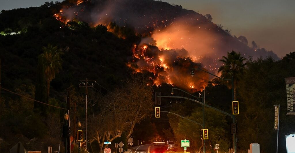 Fires burn in the night in the hills of Los Angeles.