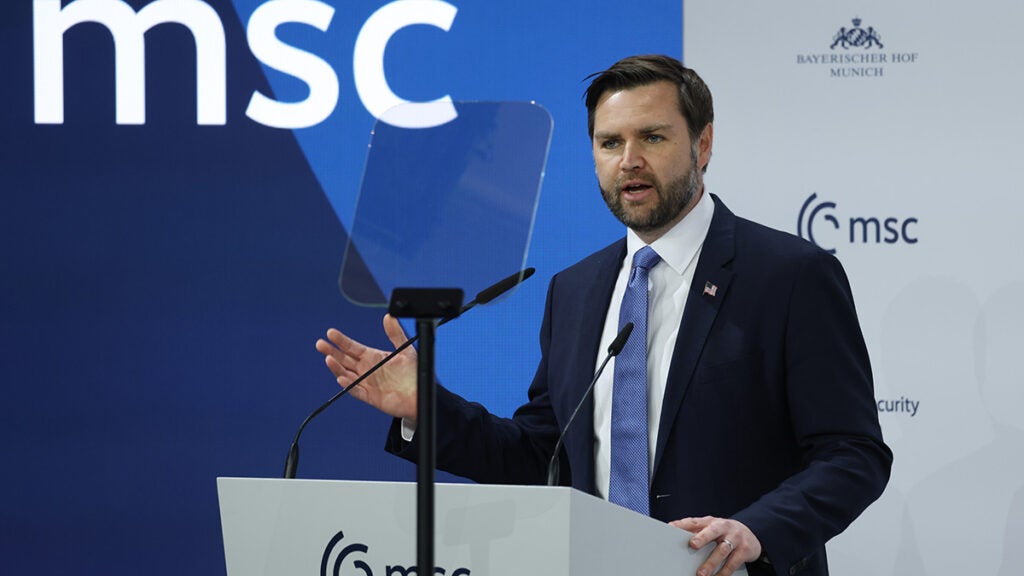 JD Vance speaks in a blue suit