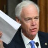 Sen. Ron Johnson, R-Wis., holding a ream of paper