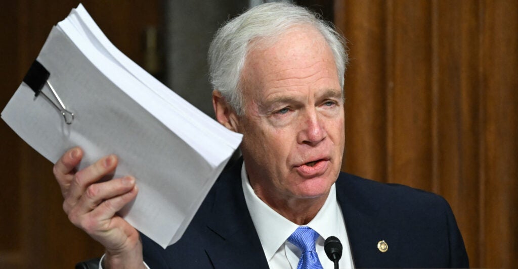 Sen. Ron Johnson, R-Wis., holding a ream of paper