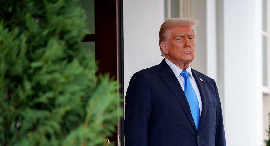 President Donald Trump in a blue suit with a blue tie