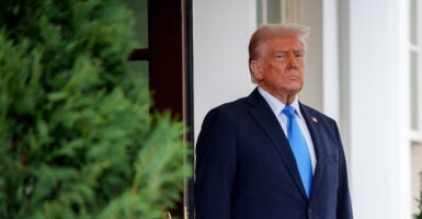 President Donald Trump in a blue suit with a blue tie