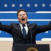 Elon Musk exults with raised fists