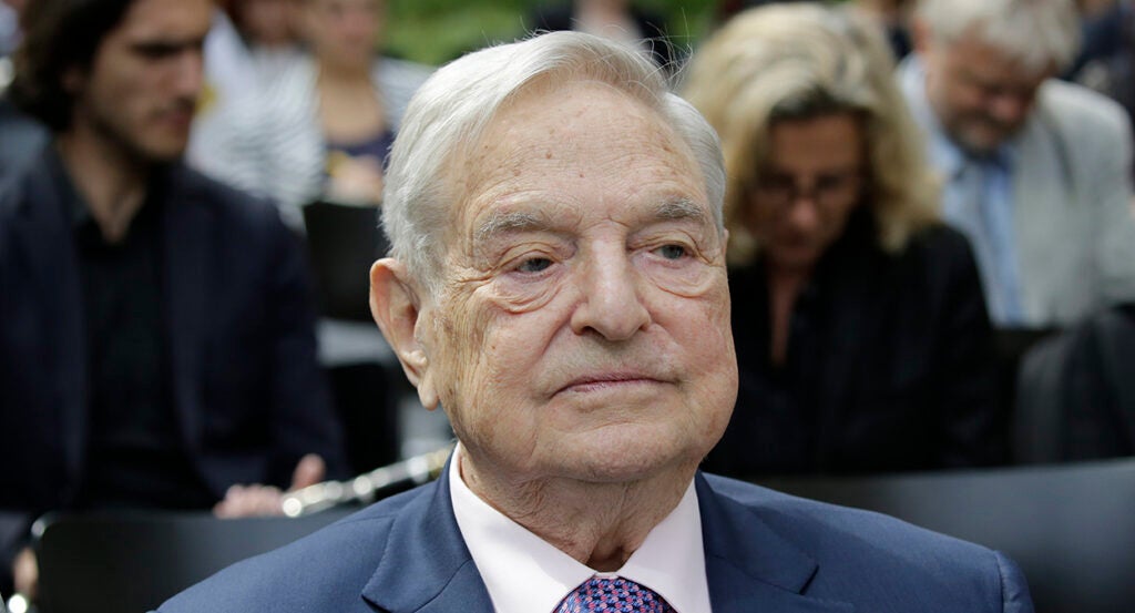 George Soros in a blue suit