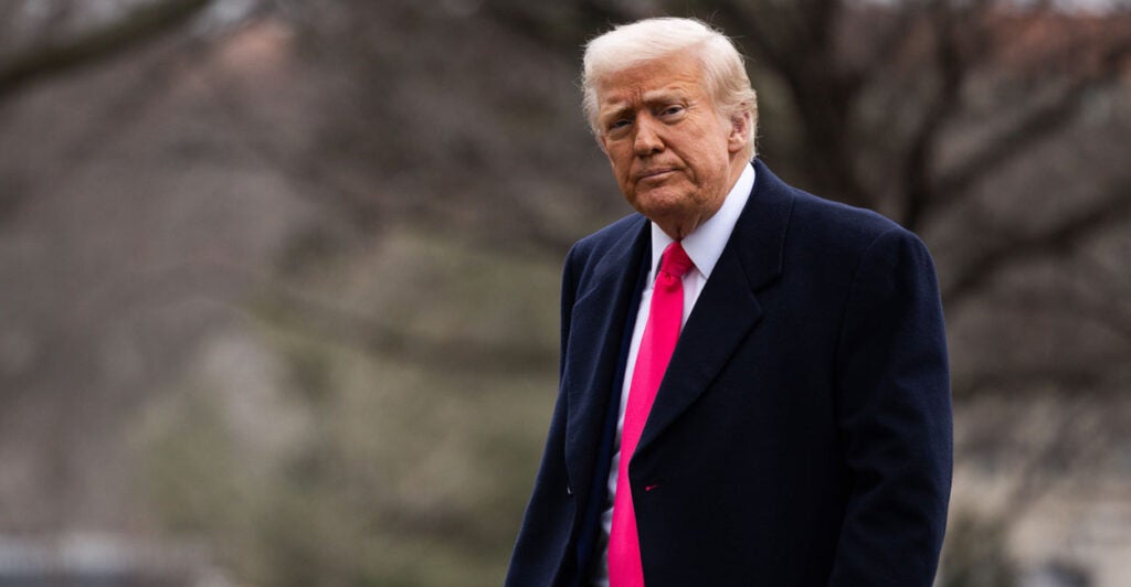 President Donald Trump walks outside.