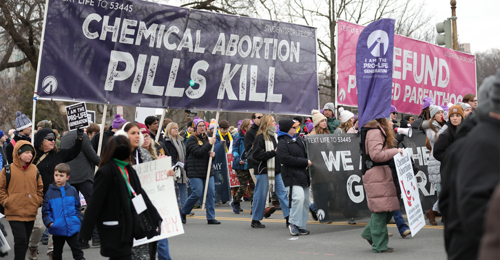 Pro-life supporters march with banners at the 2025 March for Life in Washington, D.C.