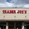 A Trader's Joe store is pictured with its name in red letters on the front of the building.