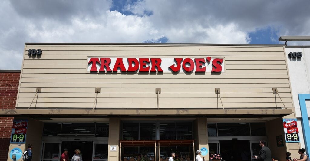 A Trader's Joe store is pictured with its name in red letters on the front of the building.