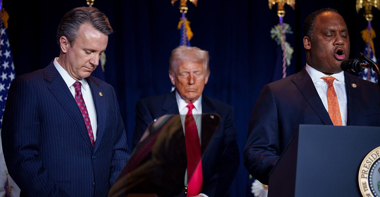 Donald Trump prays between Reps. Ben Cline and Jonathan Jackson