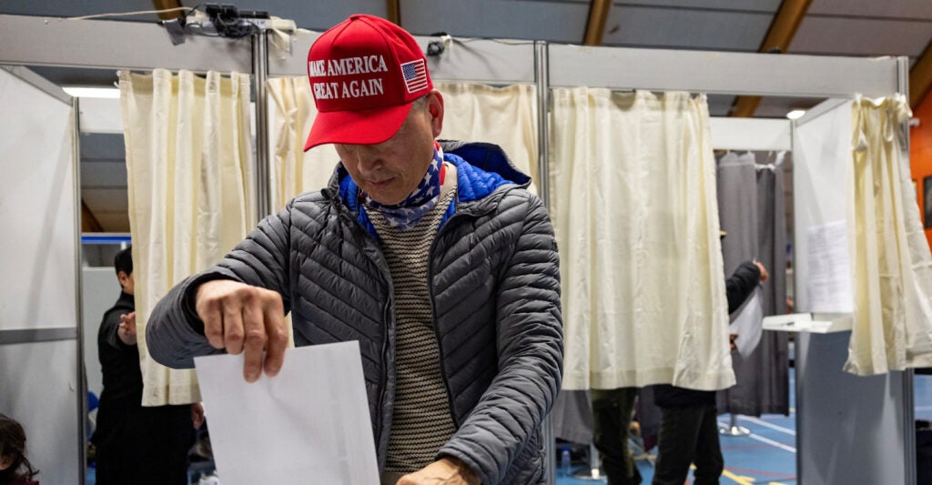 Man wears a Make America Great Again hat in Greenland.
