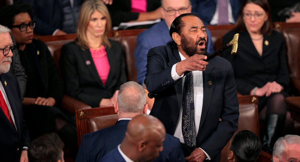 Rep. Al Green, D-Texas, shouts as President Donald Trump addresses a joint session of Congress on Tuesday night.