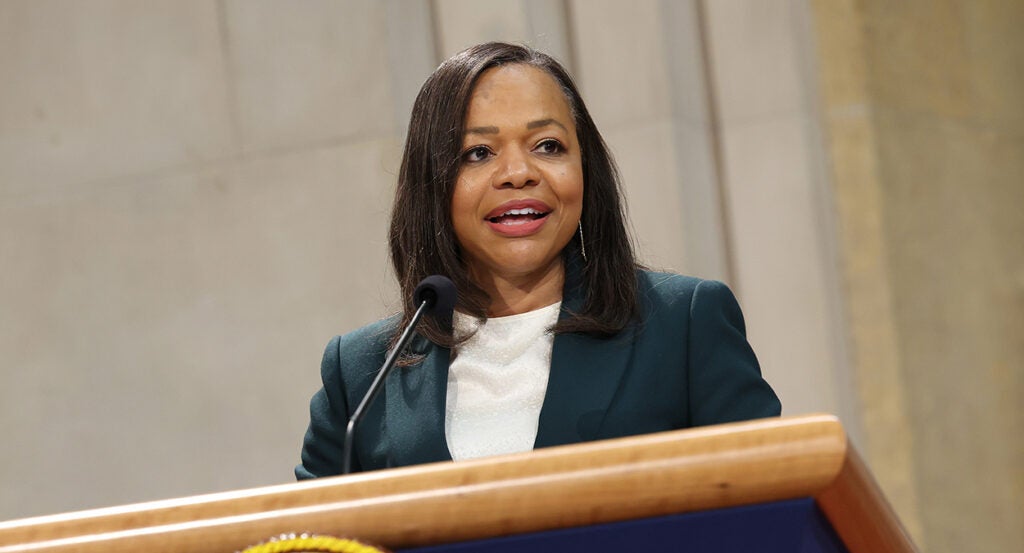 Kristen Clarke in a white shirt and a black dress jacket