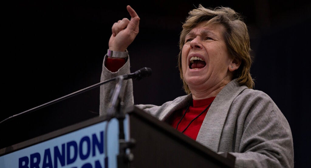 Randi Weingarten shouts behind a podium