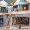 Migrant construction workers build the second story of new condo housing development in Dayton, Ohio, on June 26, 2024.