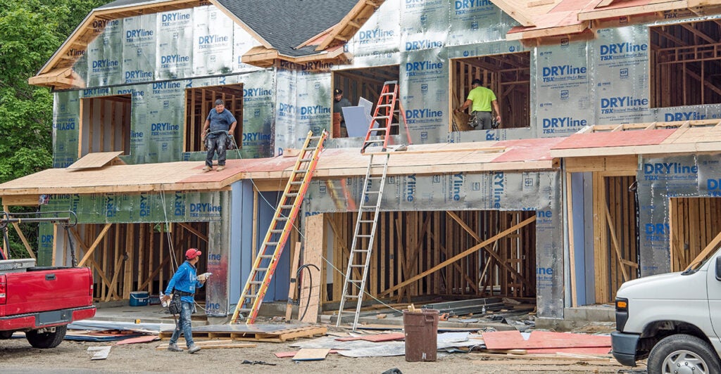 Migrant construction workers build the second story of new condo housing development in Dayton, Ohio, on June 26, 2024.