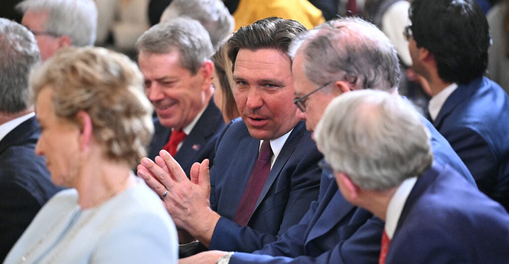 Florida Gov. Ron DeSantis attends an executive order signing by President Donald Trump on Thursday.