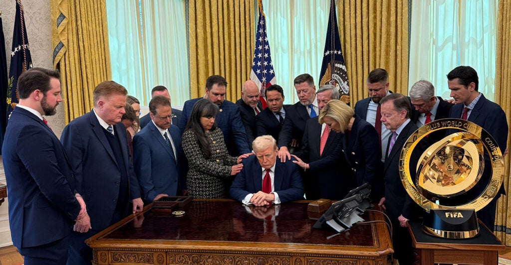 Christian leaders pray over President Donald Trump in the Oval Office on Wednesday.