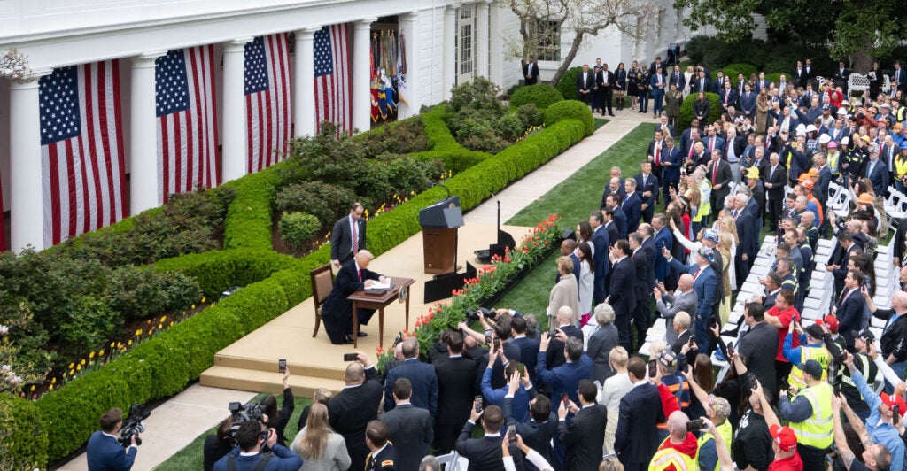 President Donald Trump signs an executive order after delivering remarks on reciprocal tariffs at a "Make America Wealthy Again" event in the Rose Garden of the White House on Wednesday.