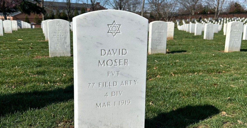 The new tombstone for Army Pvt. David Moser, with a Star of David, at Arlington National Cemetery