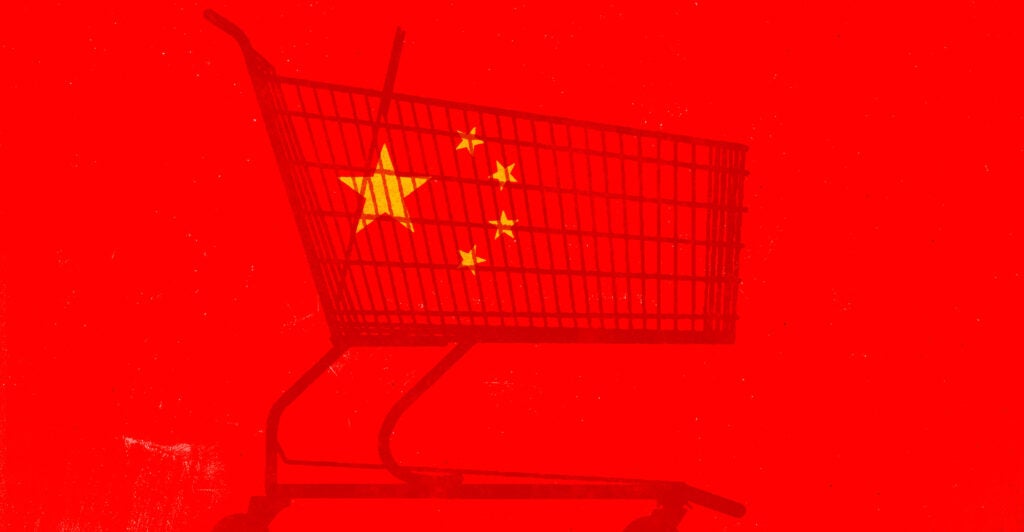 An illustration of a silhouette of a shopping cart against a backdrop of a Chinese flag.