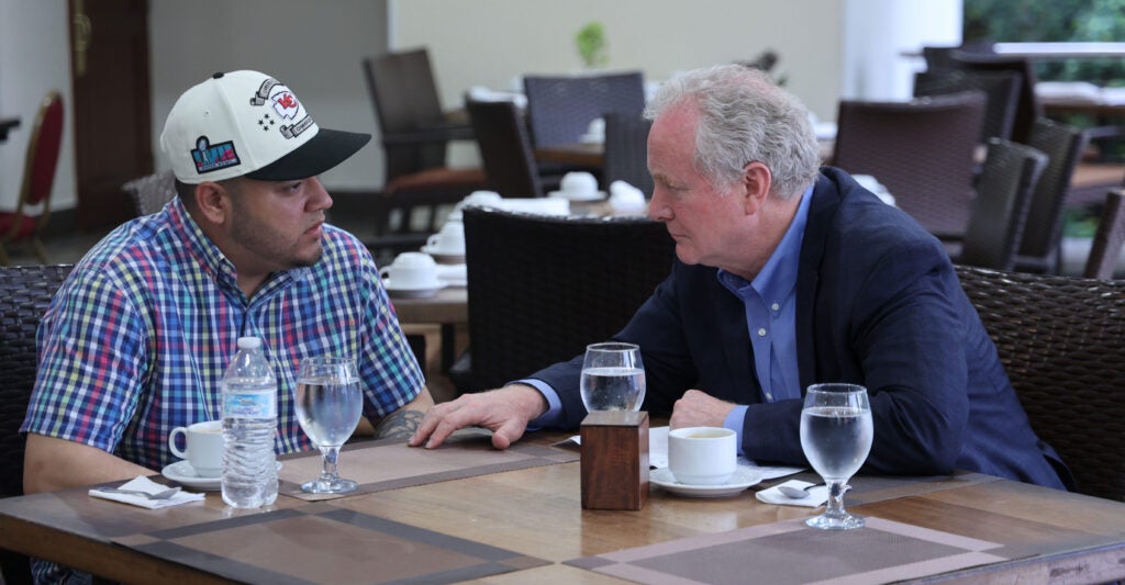 Sen. Chris Van Hollen, D-Md., meets with Kilmar Armando Abrego Garcia at an undisclosed location on Thursday in San Salvador, El Salvador.