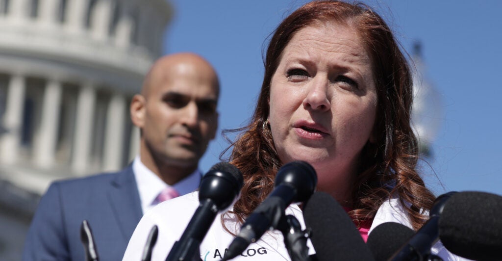 Dr. Christina Francis, CEO of the American Association of Pro-Life Obstetricians and Gynecologists, speaks as Erik Baptist, senior counsel at Alliance Defending Freedom, looks on at a Capitol news conference on March 21, 2024.