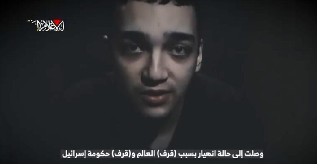 A screen grab of a video released by Hamas of American Edan Alexander. The image depicts a headshot of the haggard 21-year-old as he speaks directly into the camera.