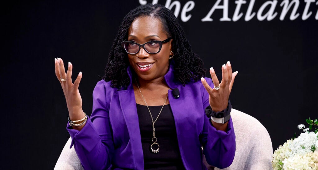 Ketanji Brown Jackson in a black dress with a blue jacket