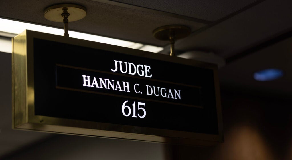 Sign with white lettering against black background reading Judge Hannah C. Dugan 615.