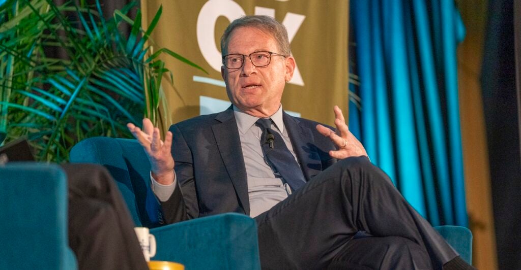 Jeffrey Goldberg sits while talking and turns to his right while gesturing with his hands.