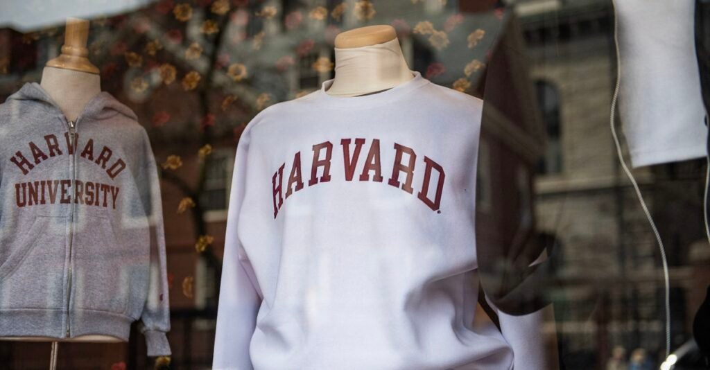 Harvard sweatshirts are displayed for sale in a school store window on the Harvard University campus.