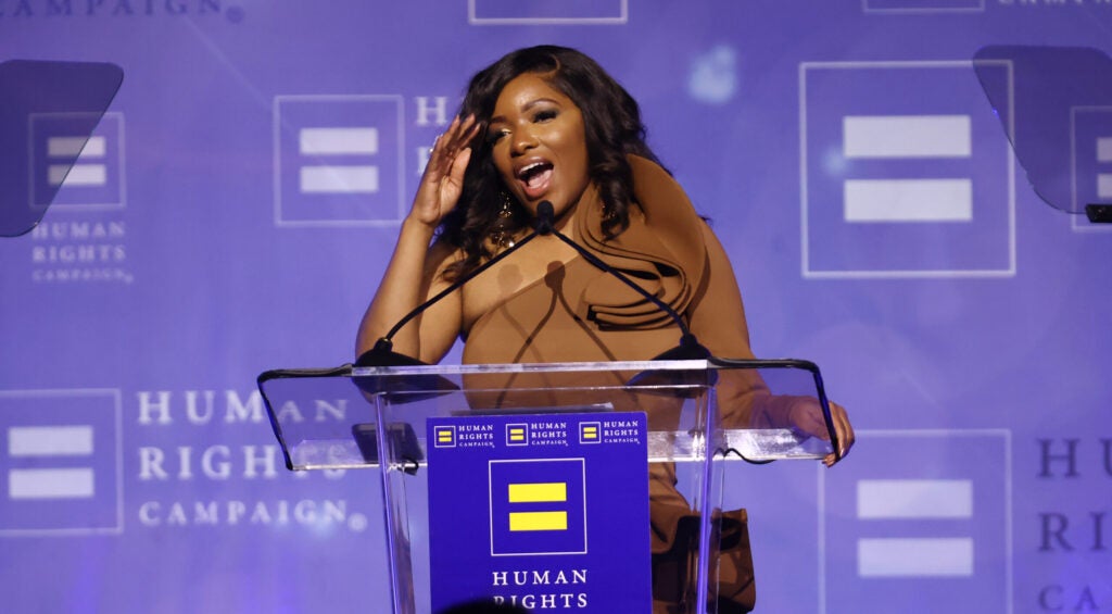 Rep. Jasmine Crockett brushes her hair back as she delivers speech to the Human Rights Campaign.