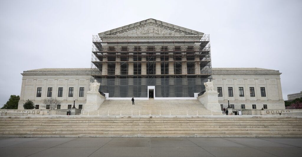 The front steps and entrance to the U.S. Supreme Court building is shown.