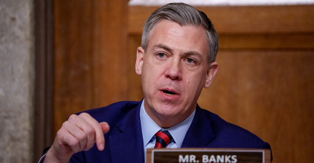 Sen. Jim Banks, R-Ind., gestures during a Senate panel hearing.