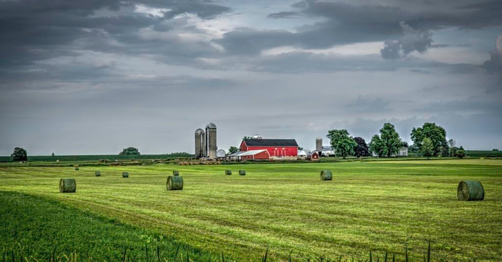 A barn is set back on a farm in Wisconsin.