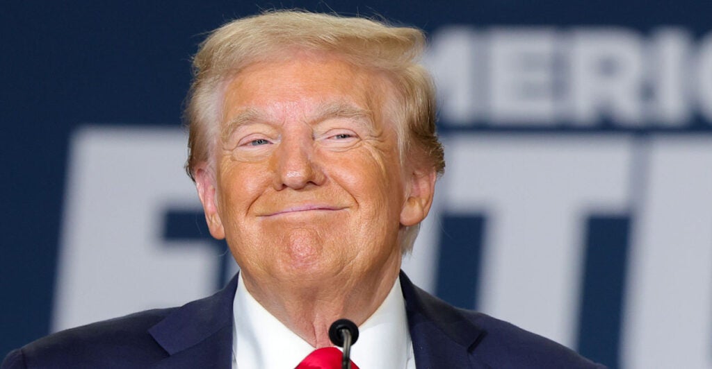 Close-up of Donald Trump grinning.