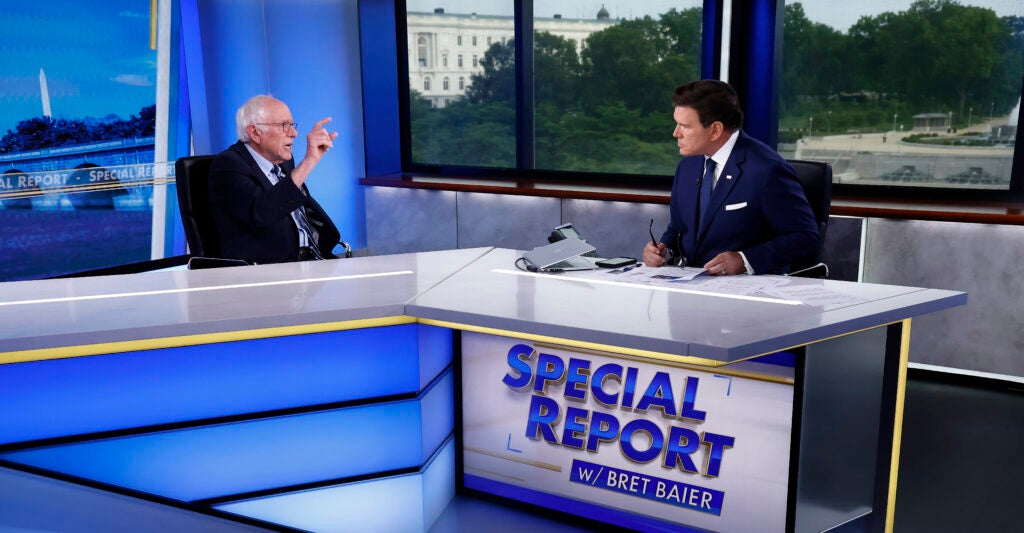 Bernie Sanders points at Fox News's Brett Baier during an appearance on Special Report.