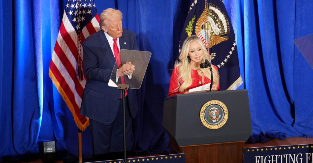 President Donald Trump looks on as Anne Fundner speaks March 14 about losing her 15-year-old son to fentanyl.