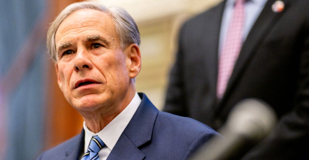 Texas Gov. Greg Abbott in a blue suit and tie