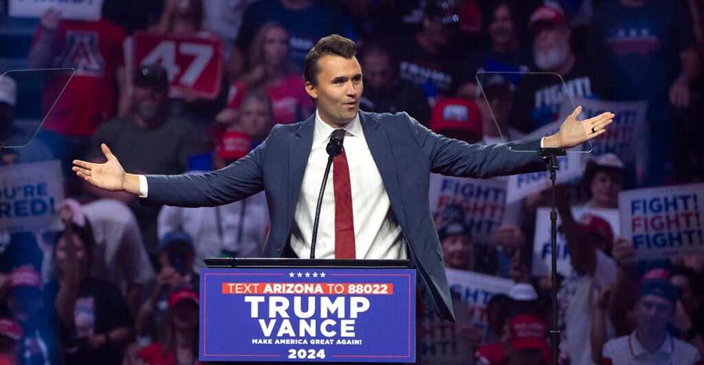 Turning Point USA President Charlie Kirk gestures
