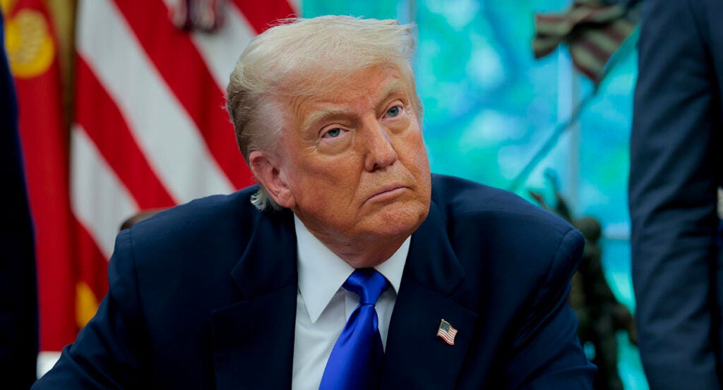 Donald Trump in a blue suit with a blue tie